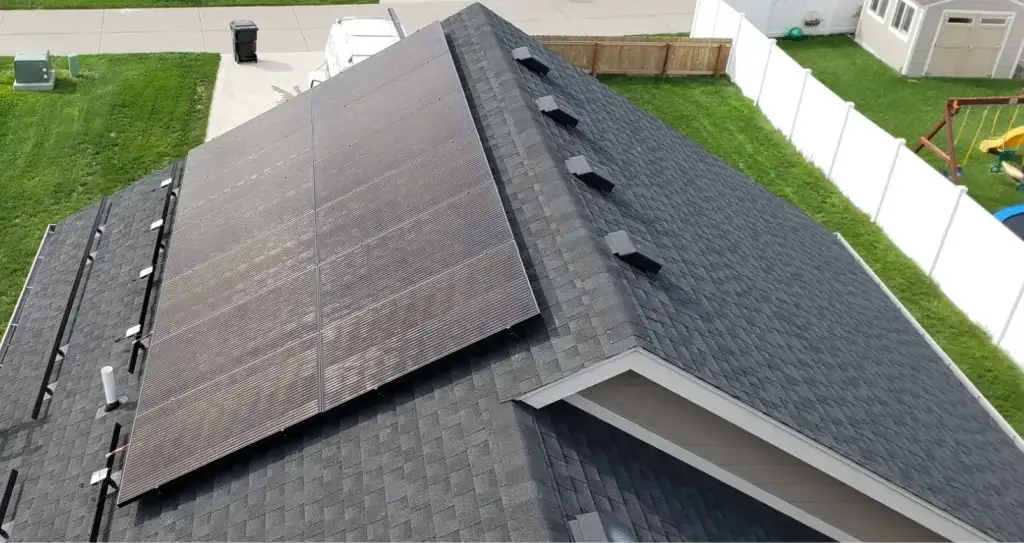A residential home with solar panels mounted on the roof